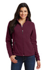 Soft midweight fleece jacket with reverse coil zipper, chin guard, and front zippered pockets for comfort.