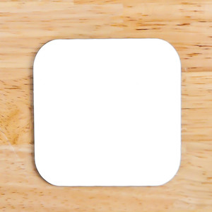 WALABlanks Sublimation Square Coaster blank on a table WALABlanks Sublimation Square Coaster blank on a table