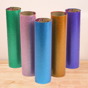 Galaxy Stretchable Glitter HTV rolls, showcasing smooth finishes and vibrant glitter particles, perfect for dark-colored garments.