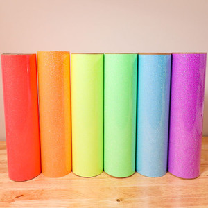 Roll of Siser Neon Glitter HTV showcasing vibrant sparkle finish.
