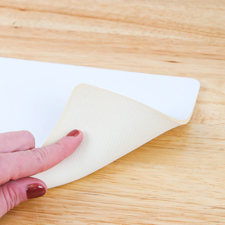 Dye sublimation ready beige mouse pad, 10"x7.5", perfect for custom photos and artwork.