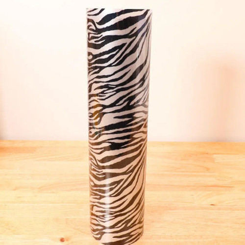 Soft metallic silver tiger heat transfer vinyl, durable and stretchy for custom garment designs.