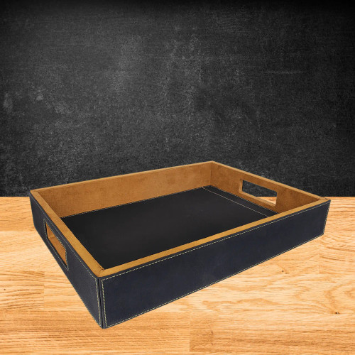 Three laserable leatherette serving trays in Black/Silver, Black/Gold, and Rawhide, displayed side by side 