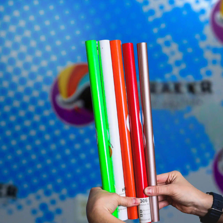 Yards of the Packaging view of Hotmark Revolution Low Temp HTV held by blue logo wall Yards of the Packaging view of Hotmark Revolution Low Temp HTV held by blue logo wall