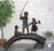 Three Kids Fishing on Log  by Paul Anderson