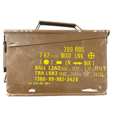 7.62 military surplus ammo can from Brass Kisses — heavy-gauge steel storage can with hinged lid and carry handle, used functional condition. Veteran-owned brand accessory.