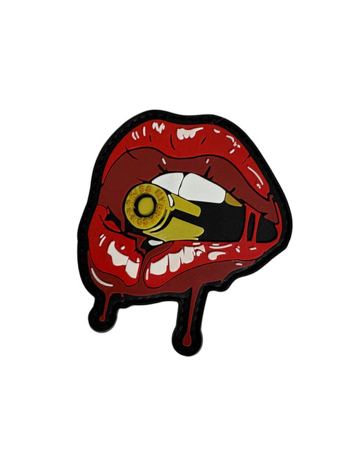 BK Lipstix PVC velcro patch — molded rubber morale patch of the Brass Kisses red lips logo, approximately 3 inches, with hook-and-loop backing. Veteran-owned brand accessory.