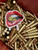 BK Lipstix sticker shown applied — die-cut Brass Kisses lips decal on gear, weatherproof high-gloss finish.