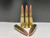 Close-up image of 300 Blackout 147 grain round nose ammunition. Each cartridge is factory new with polished brass casings, clean boxer primers, and a smooth copper-plated bullet. The rounds are neatly arranged in a uniform row on a white background, highlighting the consistent quality and craftsmanship. Ideal for range training, target shooting, and everyday carry.