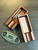 Detail of the BK Ash Tray's precision CNC machining and burnt-bronze clay finish — cut from solid billet aluminum.