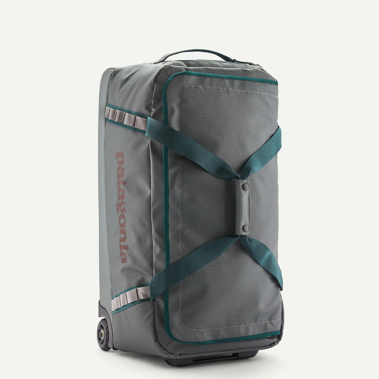 Patagonia Black Hole Wheeled Duffel 70L, gray travel duffel bag with teal straps and Zippers, with wheels and carrying handle.