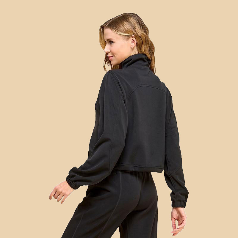 TCEC Women's Mock Neck Sweatshirt, black casual jacket with long sleeves and a stand-up collar worn by a woman against a beige background.