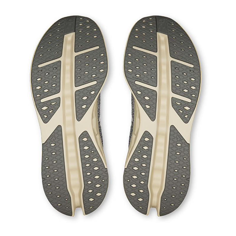 On Men's Cloudsurfer Max Running Shoes, view of the soles showing the textured grip and supportive sole design.