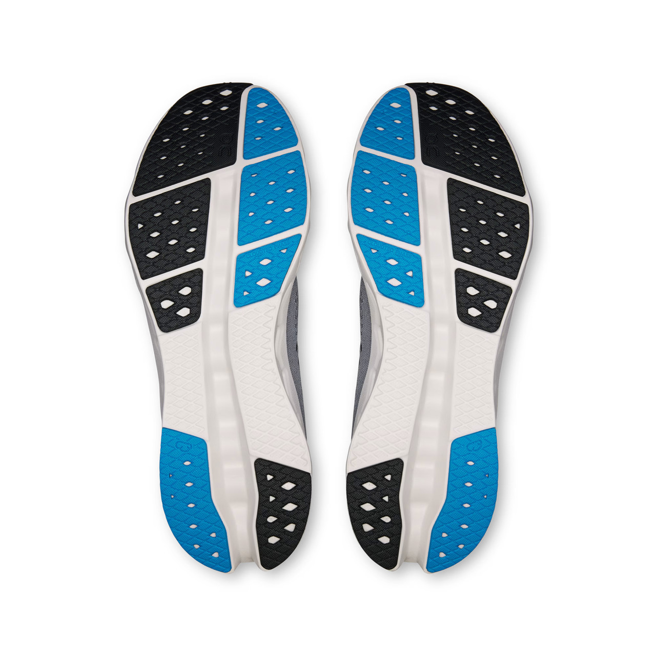 On Running Men's Cloudsurfer 2, view of the soles showing a pattern of blue, black, and white rubber segments for traction and cushioning.