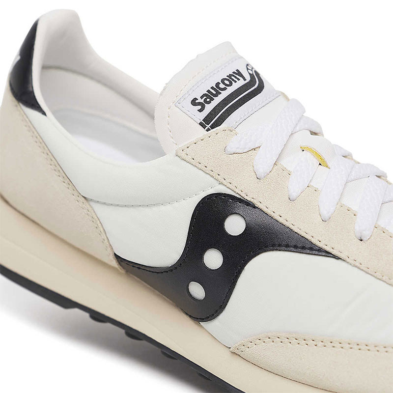 Saucony Unisex Trainer 80 Shoes, close-up image showing a stylish white sneaker with black and beige accents, featuring the Saucony logo and white laces.