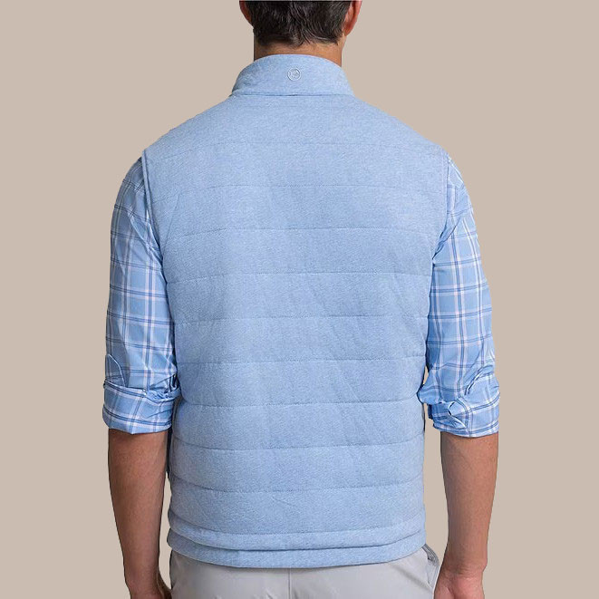 Southern Tide Men's Vest Harbor Reversible, back view of a man wearing the light blue reversible vest with a plaid shirt underneath.