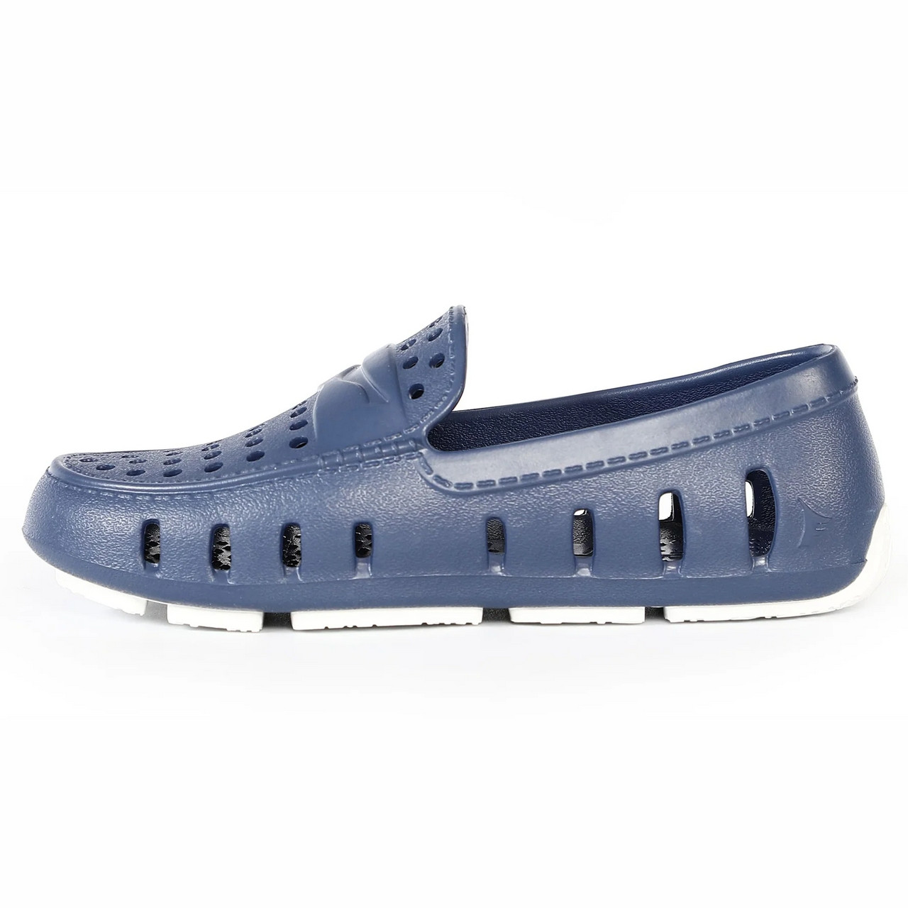 Floafers Youth Prodigy Driver, a navy blue slip-on water shoe with ventilation holes and a white sole designed for children.