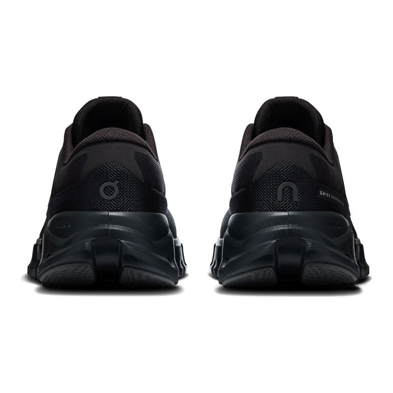 On Running Women's Cloud X 5, rear view of black athletic running shoes showcasing their cushioned soles and sleek design.