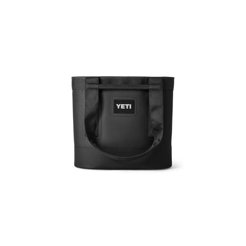 YETI Coolers Yeti 20 Camino Carryall Tote Bag, black insulated tote bag with sturdy handles and YETI logo patch for keeping food and drinks cold during outdoor activities.
