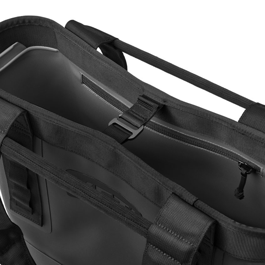 YETI Coolers Yeti 20 Camino Carryall Tote Bag, close-up image showing the interior and zipper compartments of the black tote bag made of durable material with straps for easy carry.