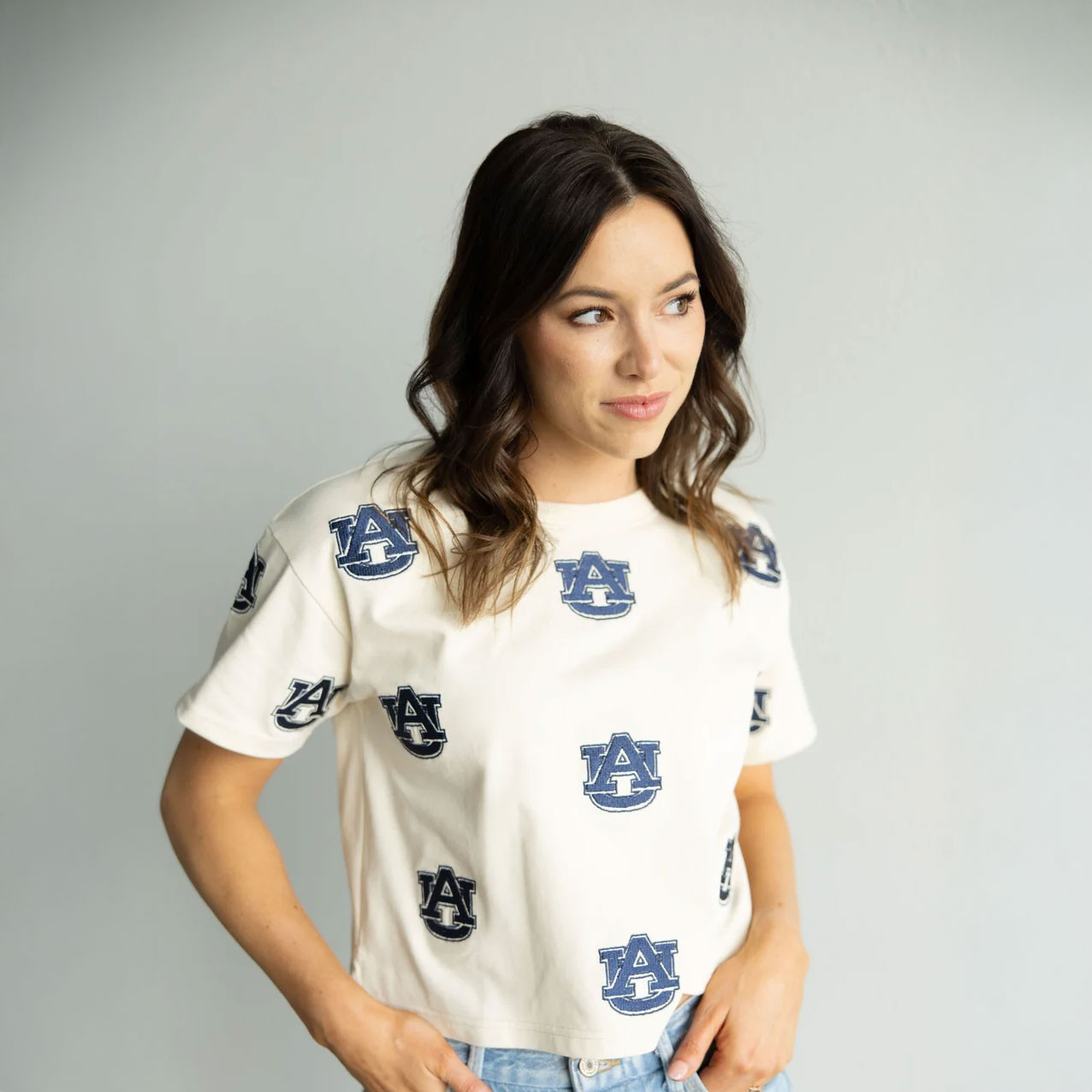 Gameday Social Apparel Gameday Social Women's Auburn Ritter Repeat Heavyweight Tee, a woman wearing a white heavyweight t-shirt with navy blue Auburn logo print.