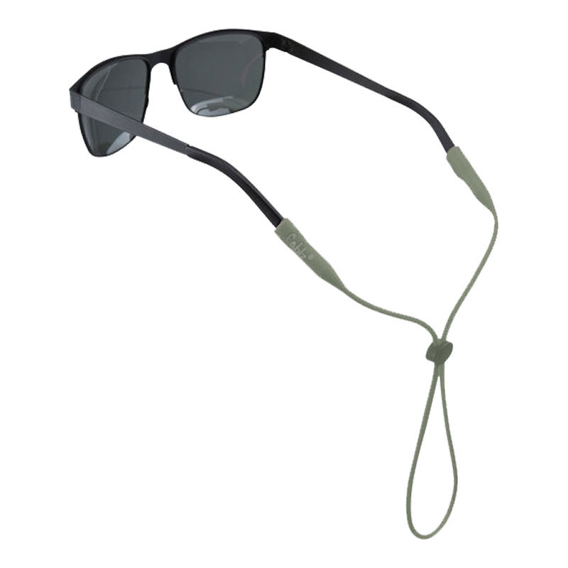 Cablz Zipz Silicone Comfort Colorz sunglasses holder, with black sunglasses attached, featuring a beige silicone strap for secure fit.