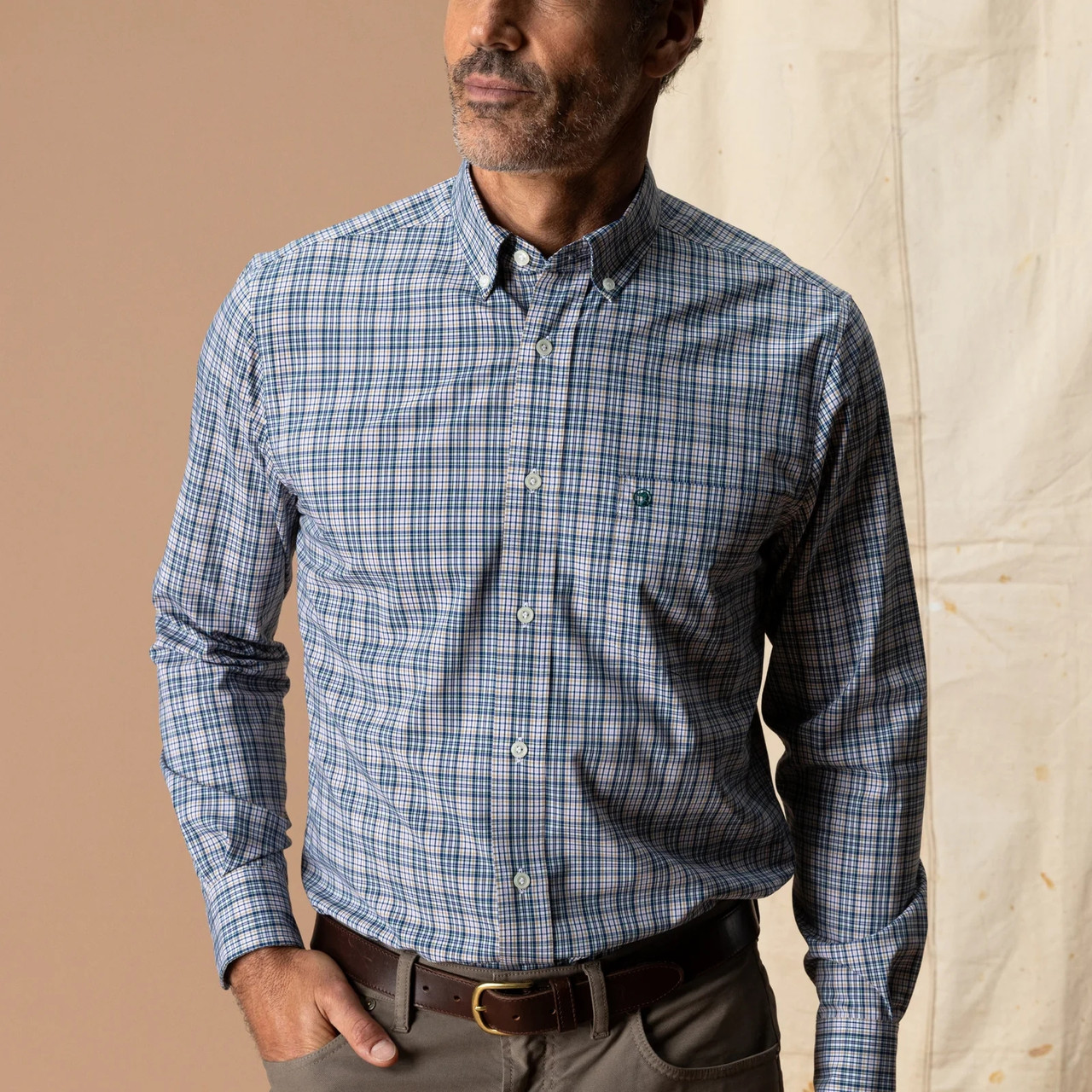Duck Head Men's Winstead Plaid Poplin Sport Shirt, model wearing a blue and white button-down plaid shirt with a chest pocket and long sleeves