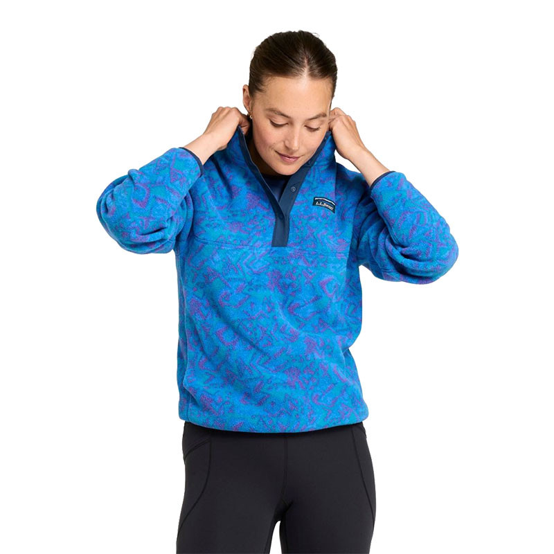 L.L.Bean Women's Mountain Classic Fleece Pullover Print, model wearing a blue and purple patterned fleece pullover with a navy quarter-button placket and stand collar.