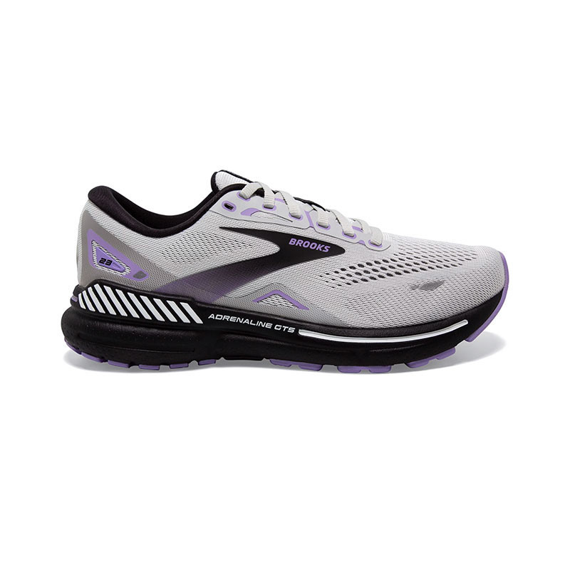 Brooks Women's Adrenaline Gts 23, athletic running shoe with a breathable white and purple mesh upper, black midsole, and cushioned sole design.