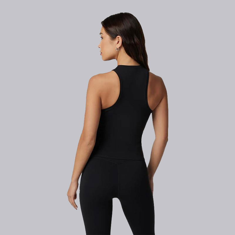 Vuori Women's AllTheFeels Crew Tank, black sleeveless athletic tank top on a female model with a gray background.