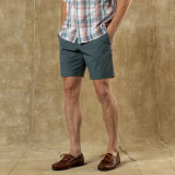Duck Head Men's Harbor Performance Short - 8" Inseam, men's dark gray casual shorts worn with plaid shirt and brown leather shoes.