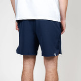 Rhoback Men's Grit Gym Short - 7" Inseam, navy athletic shorts worn by a person standing with their back to the camera.