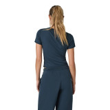 Vuori Women's Pose Fitted Tee, back view of a woman wearing a navy blue fitted T-shirt with short sleeves and a crew neckline, paired with matching navy blue sweatpants.