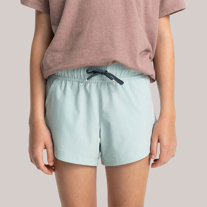 Free Fly Girls' Pull-On Breeze Short, light blue athletic shorts with an elastic waistband and adjustable drawstring for a comfortable fit.