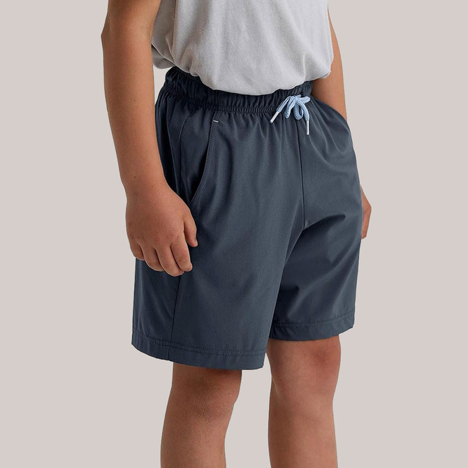 Free Fly Apparel Free Fly Boys' Breeze Short, navy blue lightweight athletic shorts with an elastic waistband and drawstring for boys' comfort and breathability.