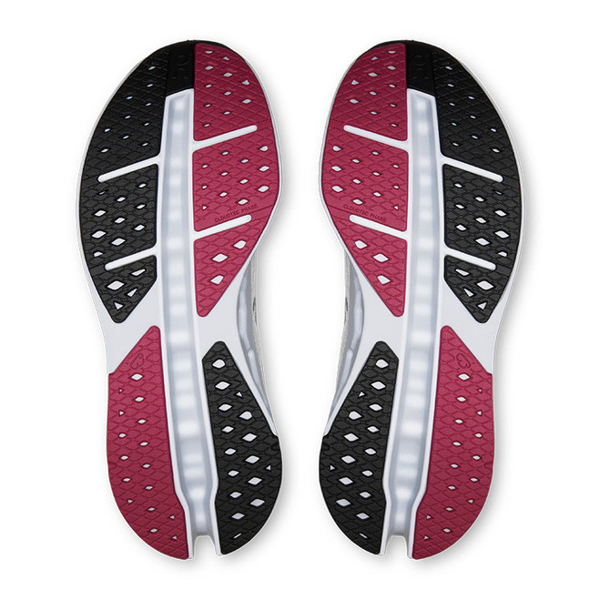 On Women's Cloudsurfer Max 1 Running Shoes, outsole view showing black, pink, and white rubber with tread pattern for grip and support.