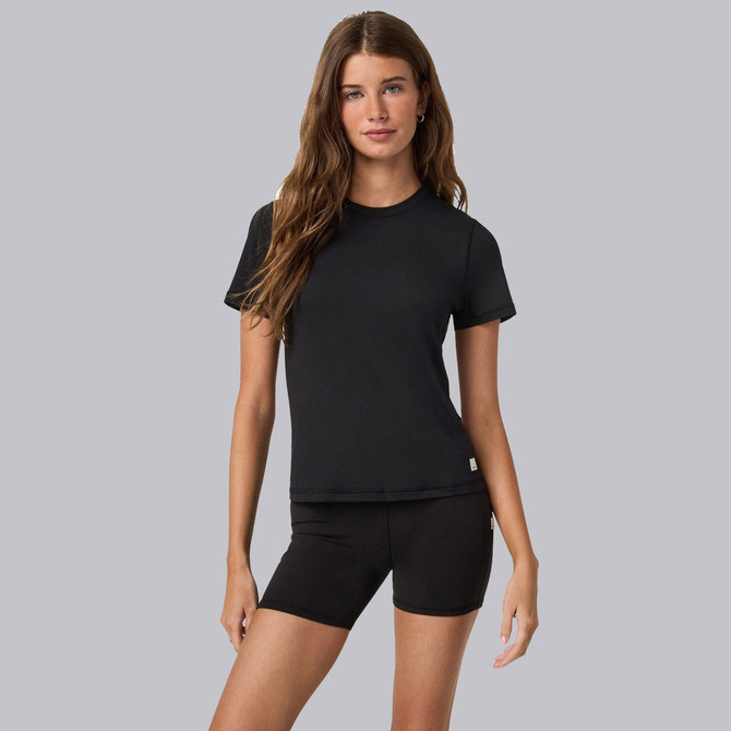 Vuori Women's Short Sleeve Lux Tee, a woman wearing a black short sleeve T-shirt, casual athletic style with a fitted silhouette.