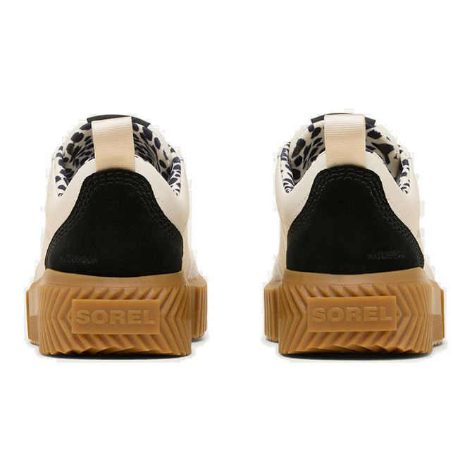 SOREL Women's Ona Ave Low Waterproof Sneaker, rear view showing black and white design with leopard-patterned lining and tan sole.