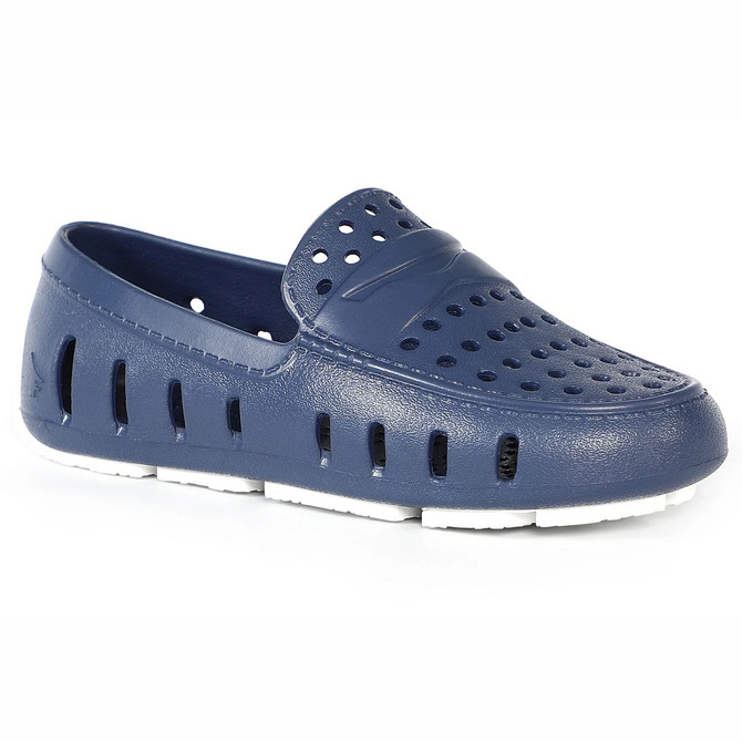 Floafers Youth Prodigy Driver, navy blue waterproof slip-on shoe with perforated holes and white sole for kids.
