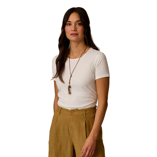 Carve Designs Carve Women's Vega Rib Tee 2.0, white fitted ribbed short sleeve T-shirt worn by a woman with long dark hair, paired with beige pants and a necklace.