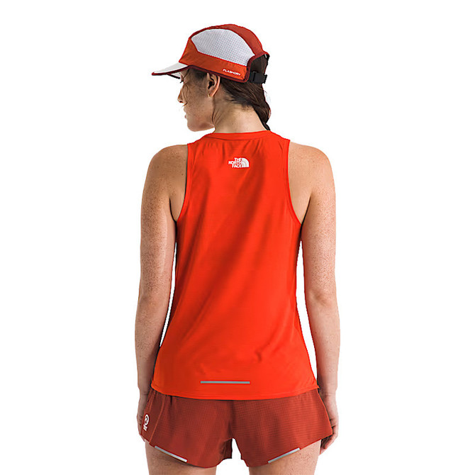 The North Face Women's Summit High Trail Tank, red sleeveless outdoor athletic top worn by a female model shown from the back.