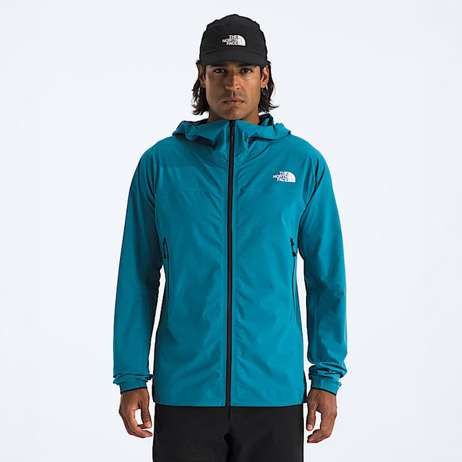 The North Face Men's Summit Off Width Jacket, a blue outdoor waterproof jacket with a hood and zippered pockets, designed for mountain climbing and outdoor adventures.