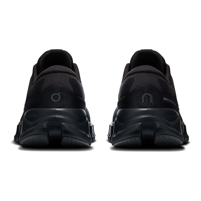 On Running Women's Cloud X 5, rear view of black athletic running shoes showcasing their cushioned soles and sleek design.