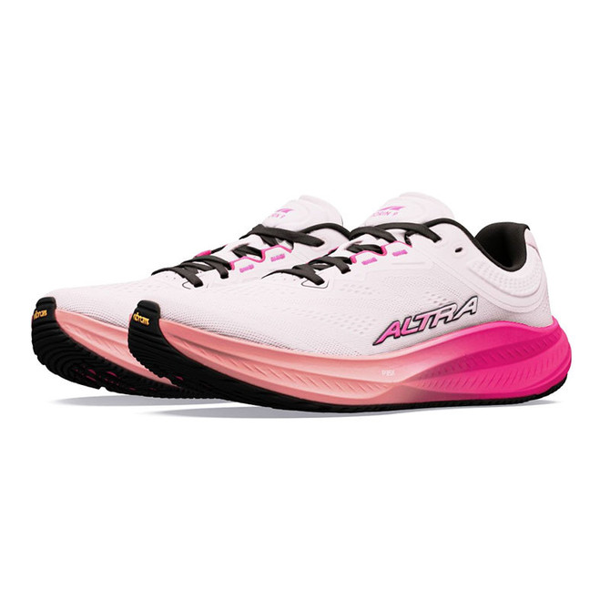 Altra Women's Torin 9, a pair of white and pink running shoes with black laces and sole, designed for comfort and performance.