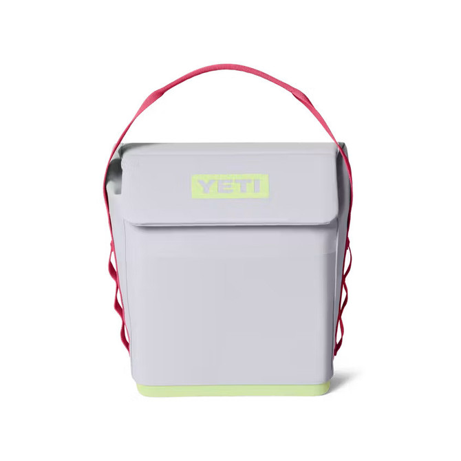 YETI Coolers Yeti Daytrip 6L Lunch Box, portable insulated lunch box with a pink shoulder strap and bright yellow logo on the front.