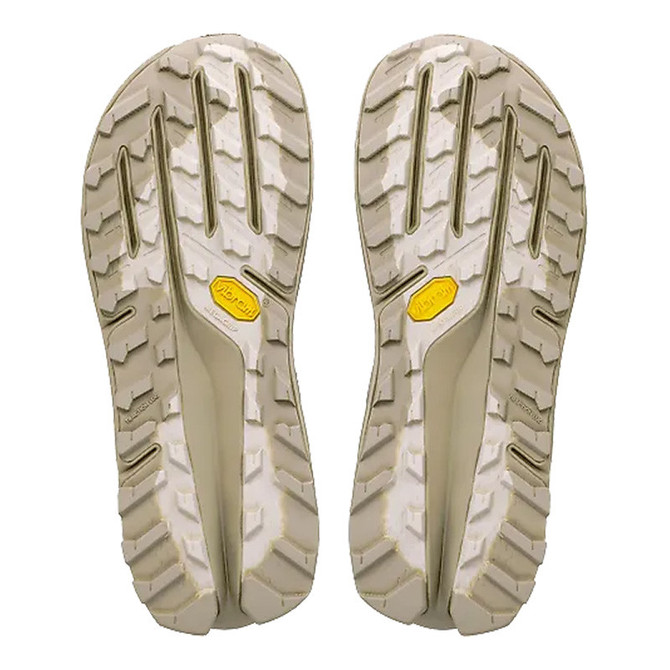 Altra Women's Olympus 7, image of the soles of the running shoes showing durable tread and Vibram outsole for traction.