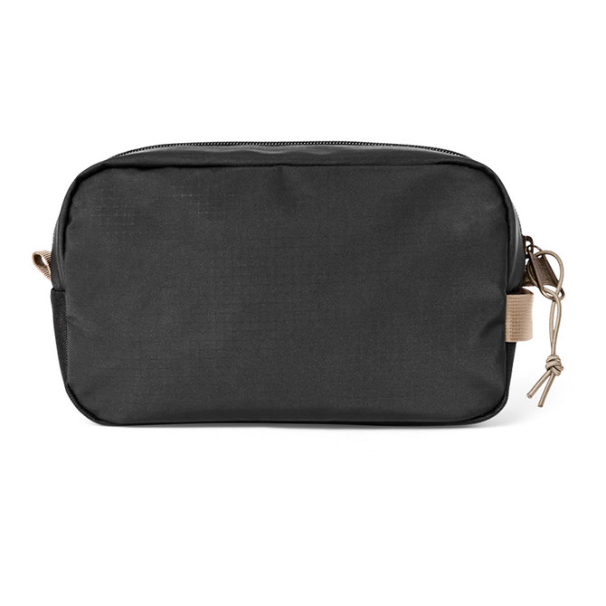 Filson Outdoor Clothing & Bags Filson All-Weather Dopp Kit, black waterproof travel toiletry bag with zipper closure and beige accents.