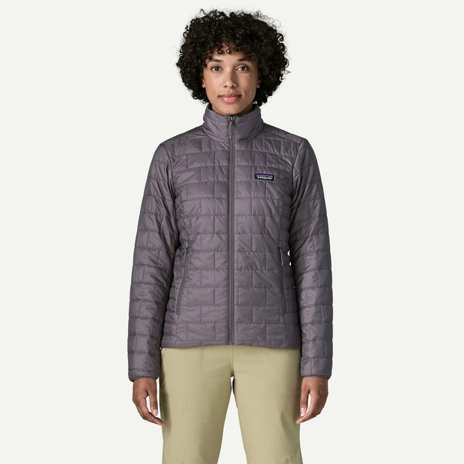 Patagonia Women's Nano Puff Jacket, lightweight and insulated outdoor jacket for women with a grey color, standing collar, and zippered pockets.