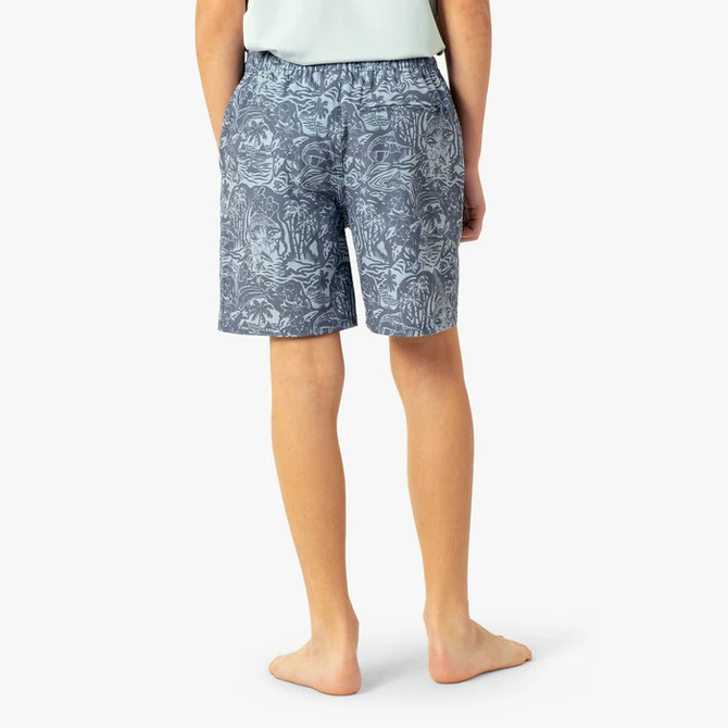 AFTCO Boys' Strike Printed Swim Short, front view of a child modeling the blue and gray patterned swim shorts with side pockets and elastic waistband.
