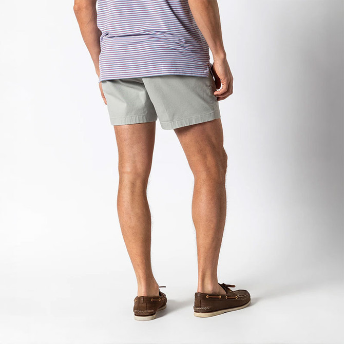 Duck Head Men's Gold School Short - 5" Inseam, beige casual shorts for men with a tailored fit, paired with brown boat shoes and a striped t-shirt, perfect for summer wear.